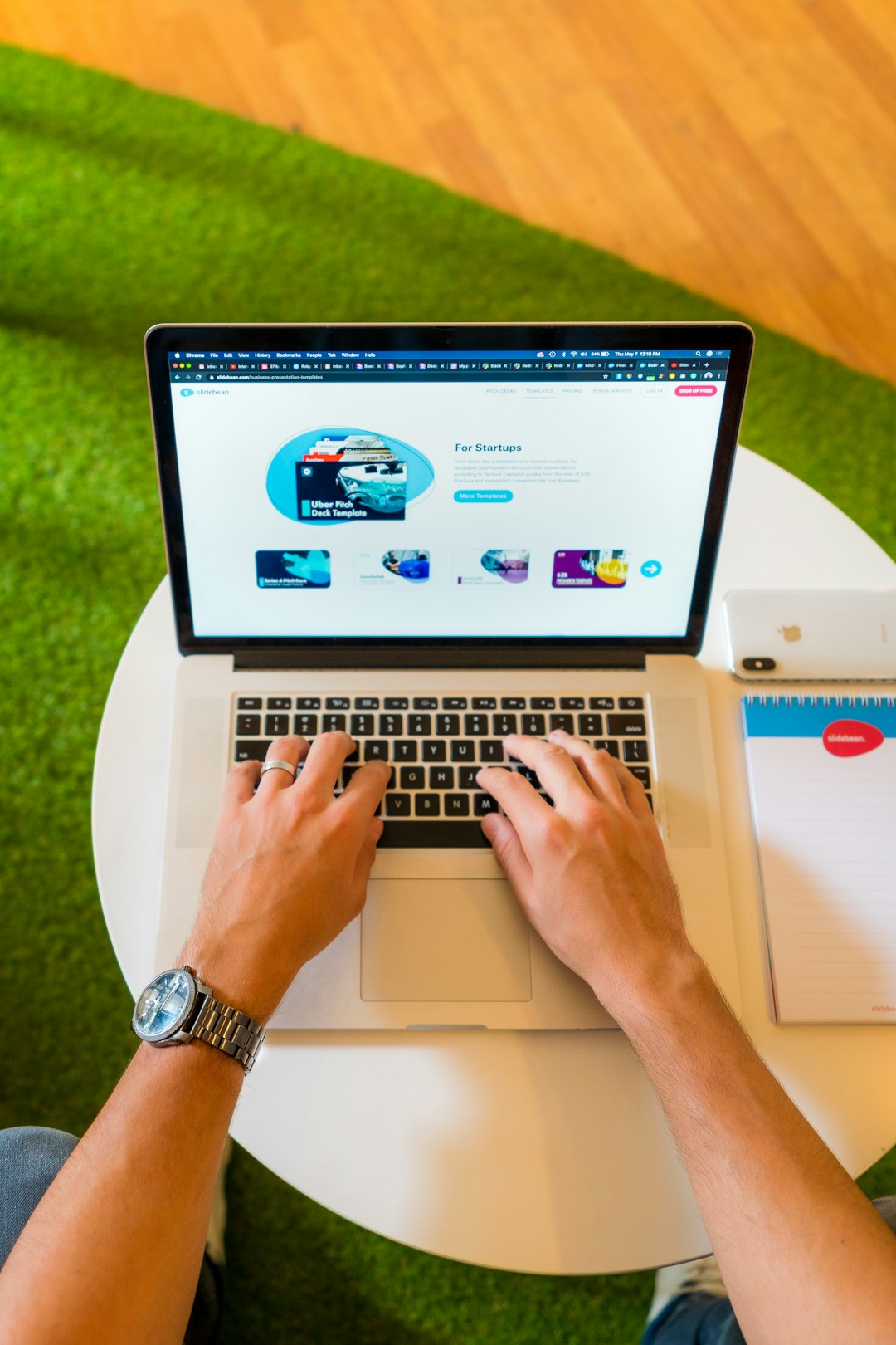 person-using-macbook-pro-on-white-table-g5fta8zfl6m